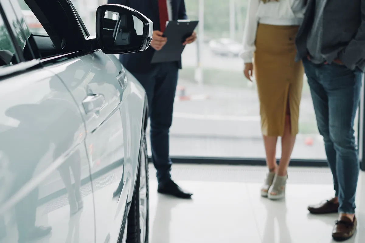 New cars on display in a dealership showroom