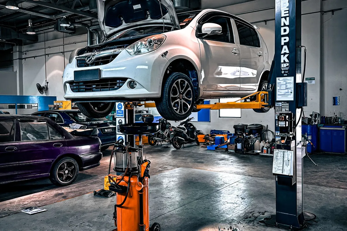 A car on a lift in a modern independent repair shop